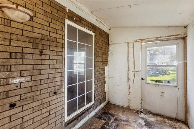 View of unfurnished sunroom | Image 23