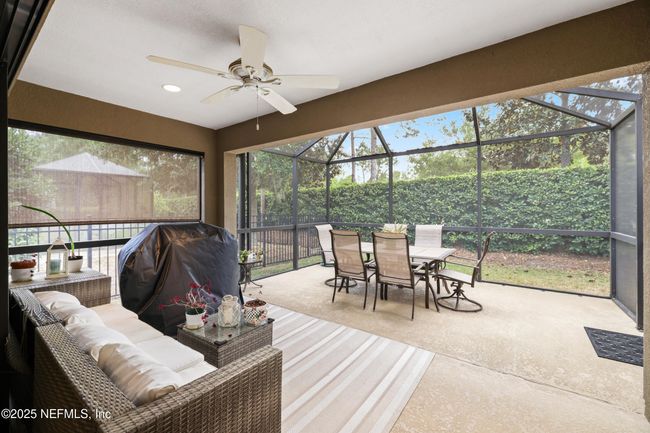Enjoy Florida living year-round from this screened lanai, with a roof-covered section perfect for relaxing—rain or shine. | Image 17