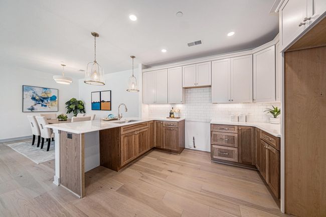 Two tone cabinetry, beautiful subway tile backsplash. Prepped for gas range. | Image 7
