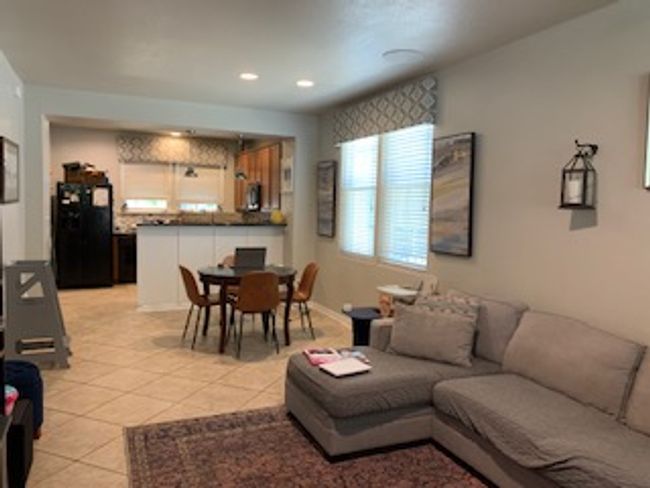 Living room with light tile patterned floors and recessed lighting | Image 6