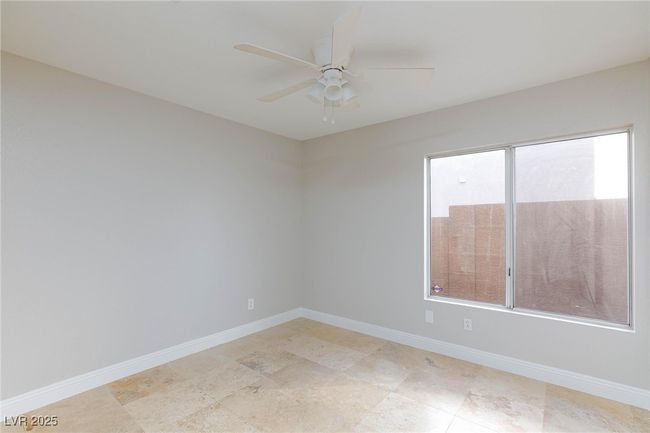 Empty room featuring baseboards and a ceiling fan | Image 11