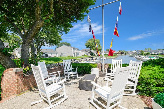 View of patio featuring a residential view and a water view | Image 22