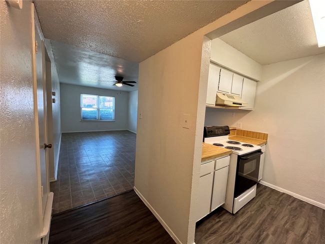 Here is a peek at the kitchen from the hallway. | Image 5