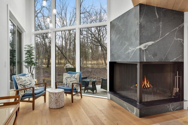 Wonderful wood burning fireplace with custom stone surround | Image 13
