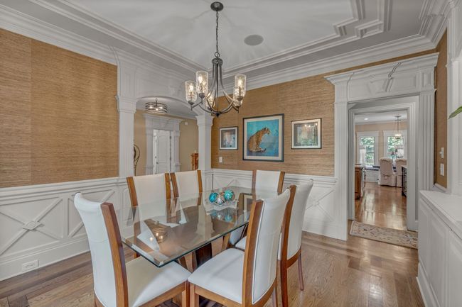 A view of the dining room with a charming tray ceiling. | Image 10