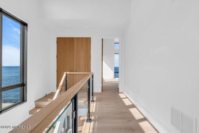 Two story foyer with oversized Anderson Windows looking out to the water. | Image 27