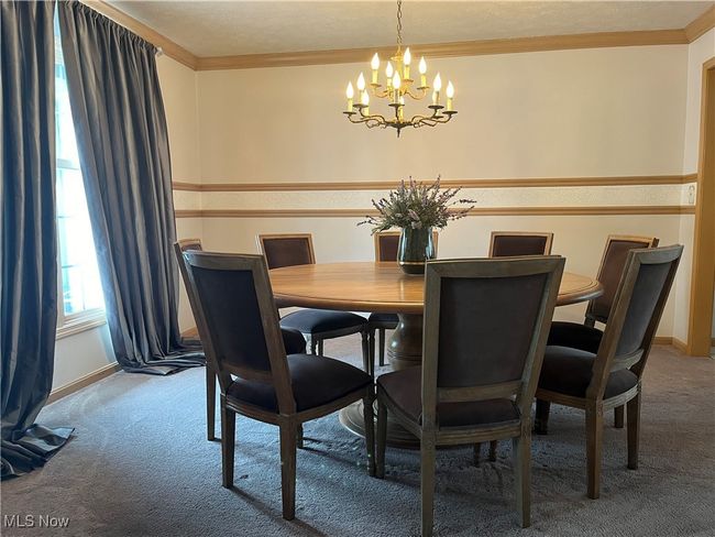 Carpeted Dining Room featuring ornamental molding | Image 7