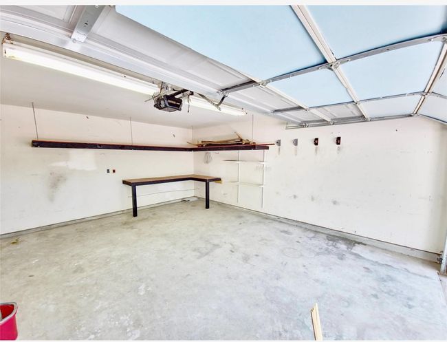 Garage featuring a garage door opener | Image 23