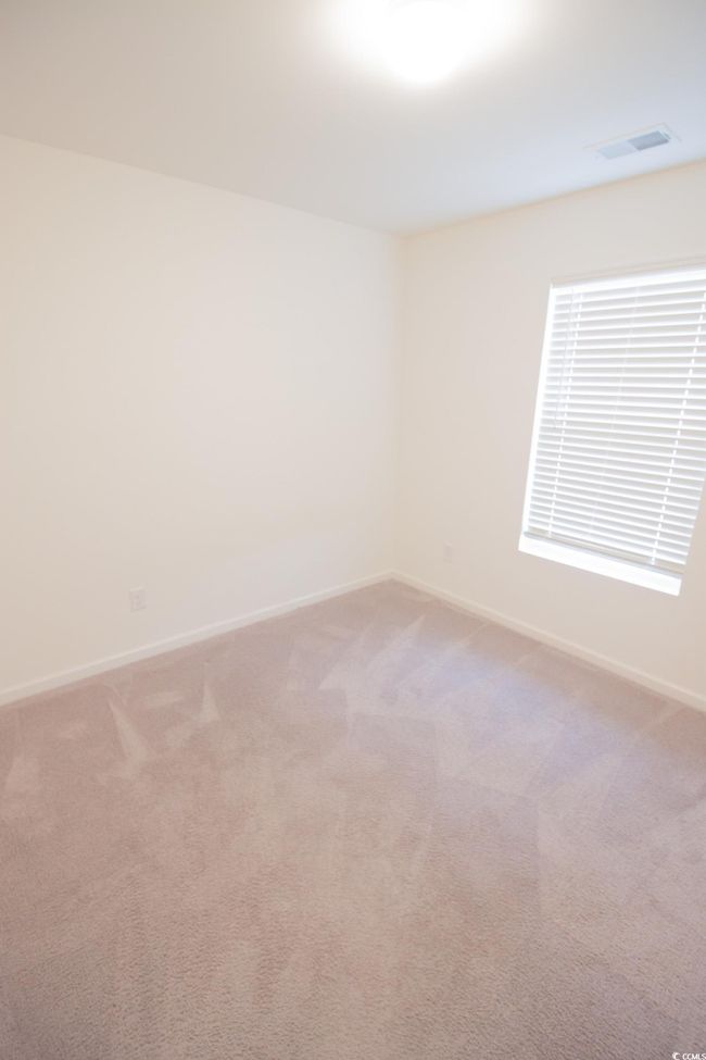 Unfurnished room with baseboards and light colored carpet | Image 15