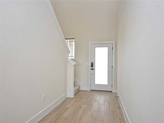 Doorway with stairway, plenty of natural light, and light wood-style flooring | Image 5
