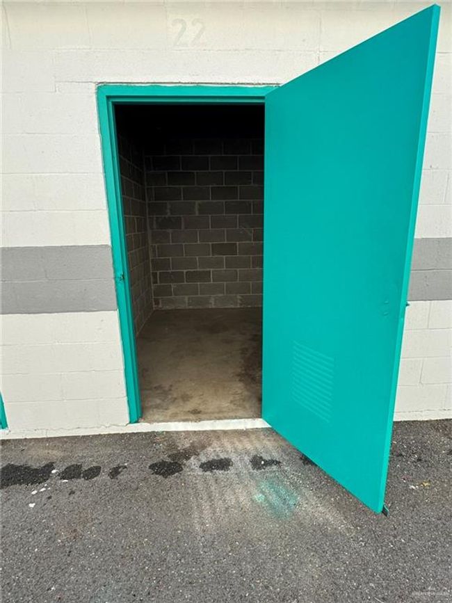Doorway to property featuring concrete block siding | Image 5
