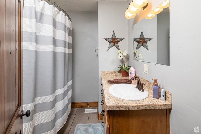 Bathroom featuring vanity | Image 26