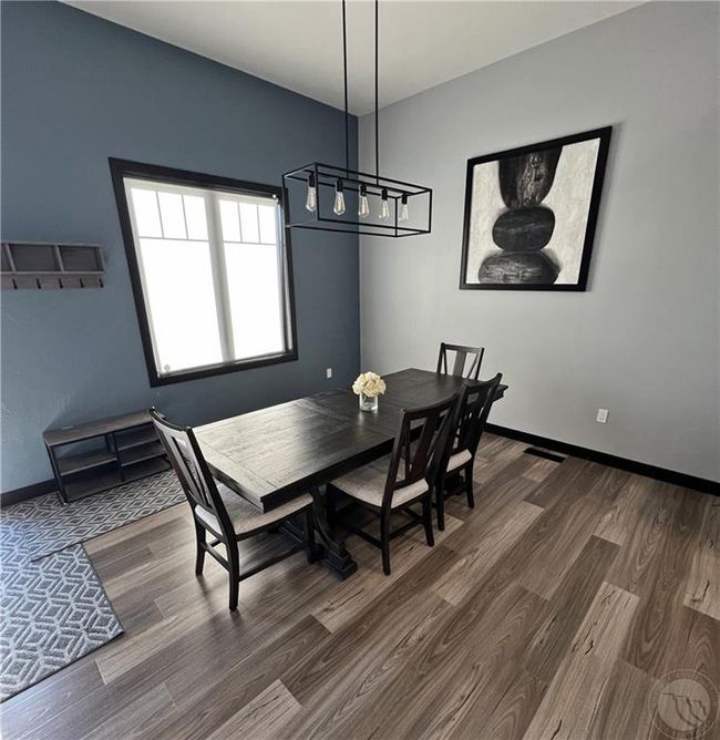 The formal dining area immediately to the left of the foyer | Image 7