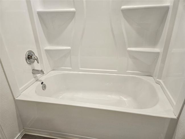 Bathroom featuring shower / bathtub combination | Image 9