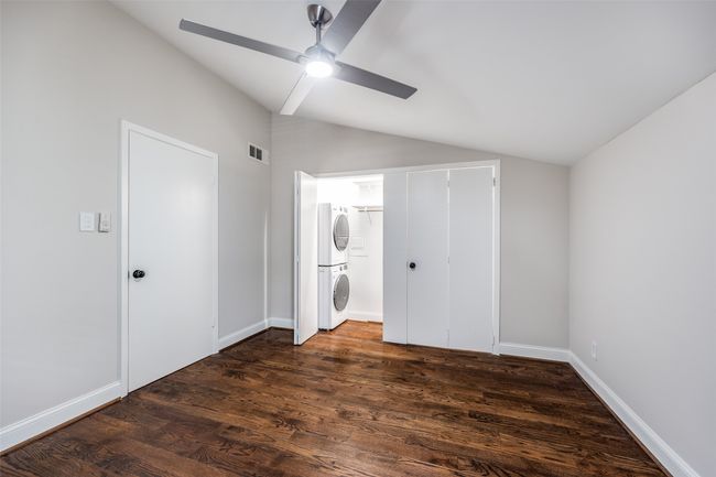 Detailed view of baseboards and stainless steel fridge | Image 8