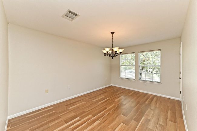 Located off the kitchen and dining area, this room offers some flexibility in its use--makes a great office, 2nd living, or formal dining room. | Image 8