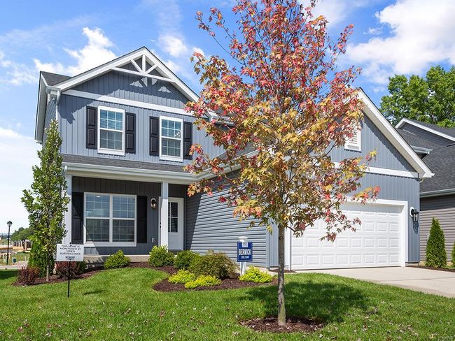 Craftsman-style house with a front yard and a garage | Image 24