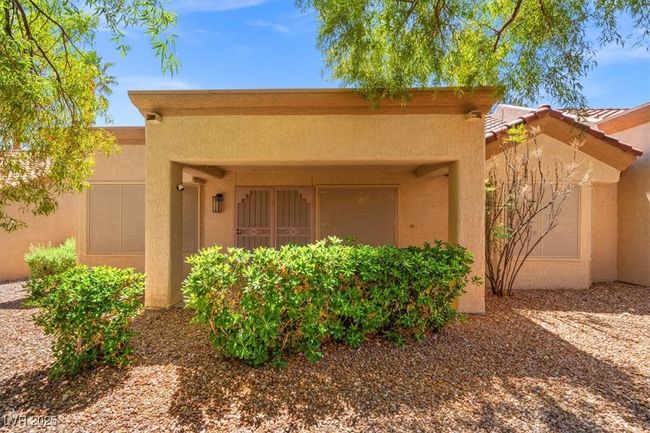 Relax & unwind in the serene covered patio in the backyard. | Image 31