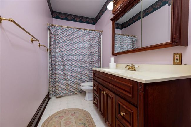 Bathroom with tile patterned floors, toilet, and vanity | Image 27