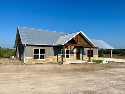 View of front of property with cooling unit and an outbuilding | Image 1