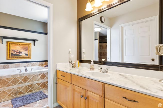 Ensuite bathroom includes double vanity, an oversized tub and a walk-in-shower. | Image 12