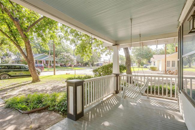 Wooden porch featuring a residential view | Image 6