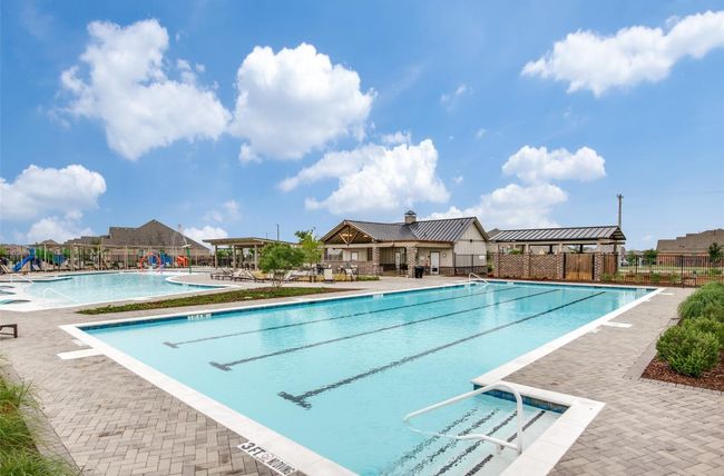This home is nestled within a vibrant community, offering top-tier amenities including a sparkling pool, playground, pickleball and basketball courts, and a community garden—making it an ideal retreat for all ages. | Image 40
