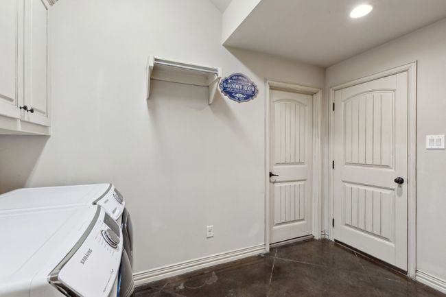 Washroom with cabinet space, washing machine and clothes dryer, baseboards, and recessed lighting | Image 29