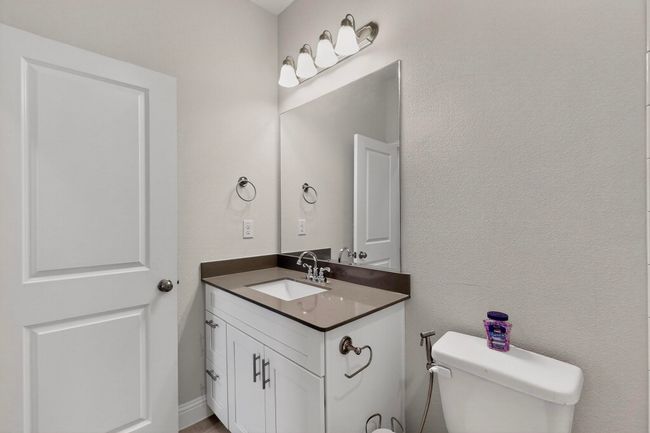 Half bathroom with vanity and toilet | Image 25