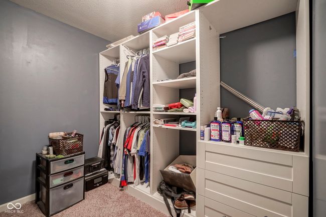 spacious closet with carpet floors | Image 24