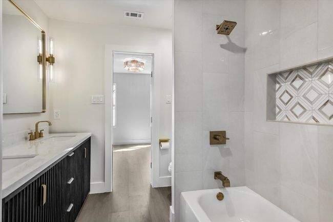 Secondary bathroom with double vanity | Image 13