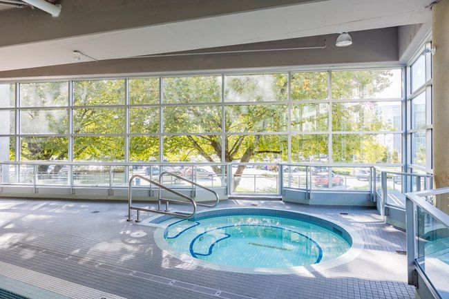 View of pool featuring a hot tub | Image 18