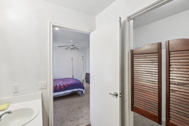 Bathroom featuring a ceiling fan and a sink | Image 12