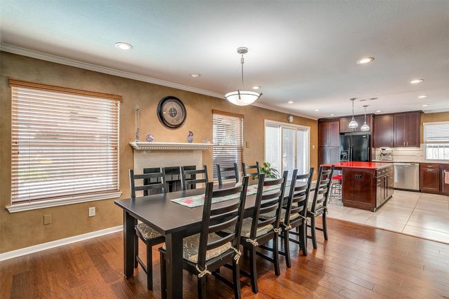 Dining Area or Optional Den with Wood Burning Fireplace | Image 13