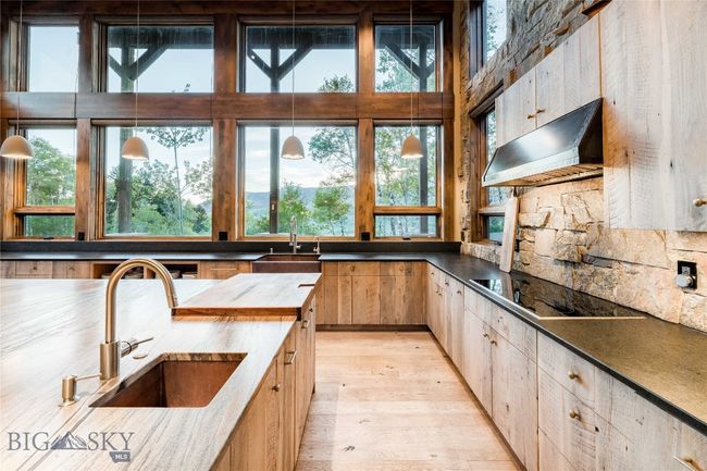 Countertop to ceiling windows let in the light and keep the views the main focus. | Image 18