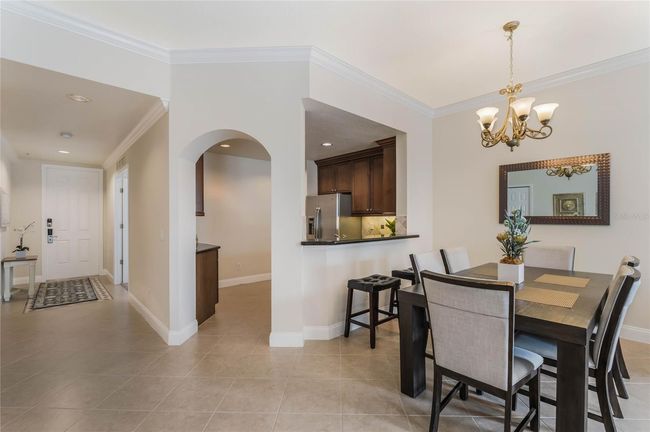 Formal dining room space with adjacent kitchen | Image 6