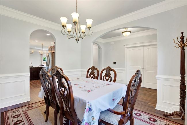 View of Dining Room looking into the foyer and Office/Flex with double doors for privacy | Image 10