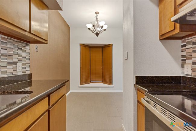 Kitchen with view of bay window in the dining/breakfast nook. | Image 4