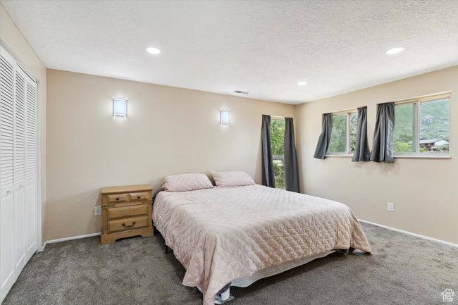 Bedroom with carpet floors, recessed lighting, and windows | Image 16