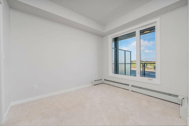 111 - 200 Shawnee Square Sw, Home with 2 bedrooms, 1 bathrooms and 1 parking in Calgary AB | Image 5