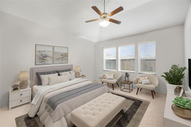 Come and unwind after a long day in this magnificent primary suite! This spacious room features plush carpet, neutral paint, sitting area, high ceilings, beautiful ceiling fan and large windows providing plenty of natrual light. *Virtually Staged | Image 13