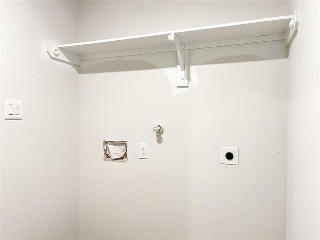 Convenient indoor utility space with washer and dryer hookups. | Image 6