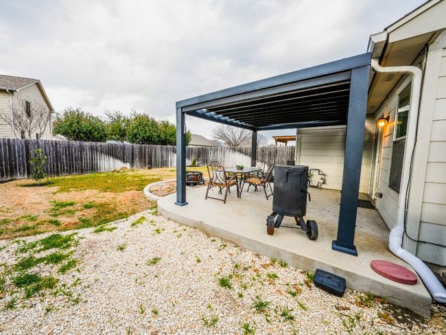 View of patio featuring a fenced backyard | Image 6