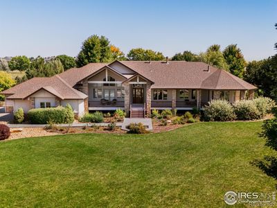 Welcome to your Boulder County dream estate nestled on over an acre of pristine land in an exclusive enclave of custom homes, where every moment feels like a cherished memory in the making. | Image 1