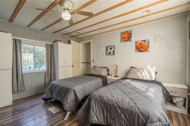 Bedroom featuring wood finished floors and a ceiling fan | Image 13