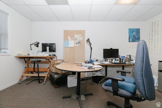 Home office featuring a drop ceiling and carpet floors | Image 22