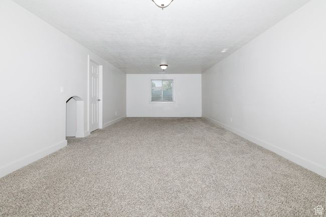 Unfurnished room featuring light carpet and baseboards | Image 21