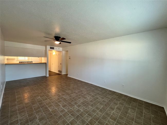 Here is the living room with the bar attached. Notice the cut out to the kitchen. | Image 8