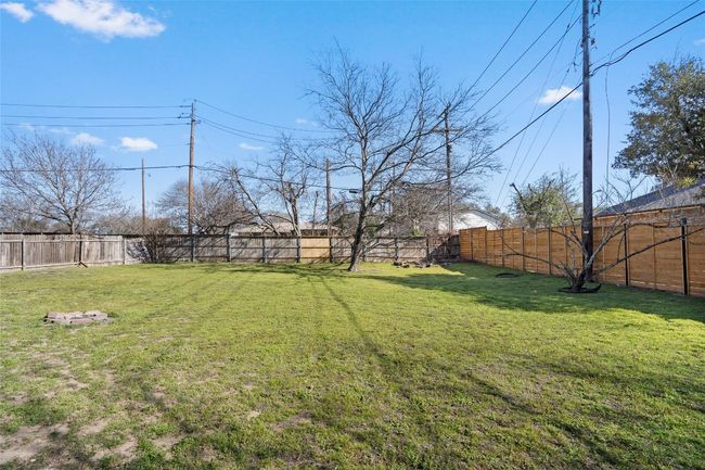 View of yard with a fenced backyard | Image 29