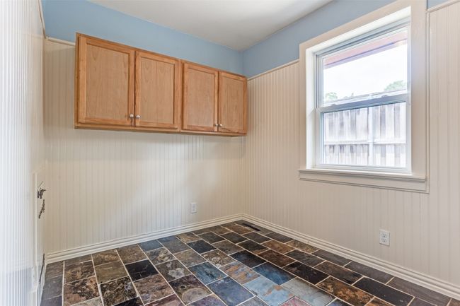 Empty room with dark stone finish floors | Image 17